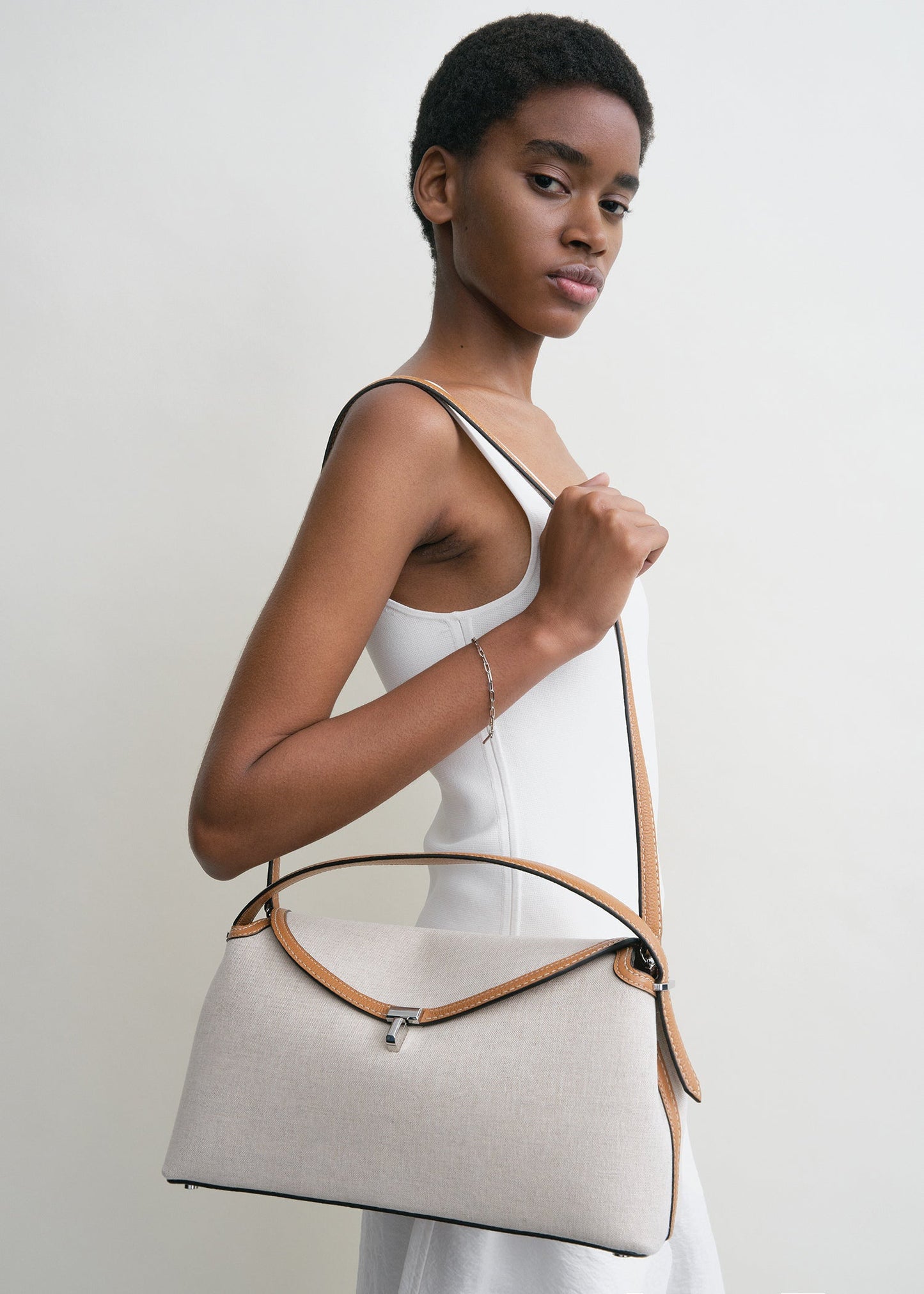 Totême T-Lock Canvas Top Handle in ecru/Tan.