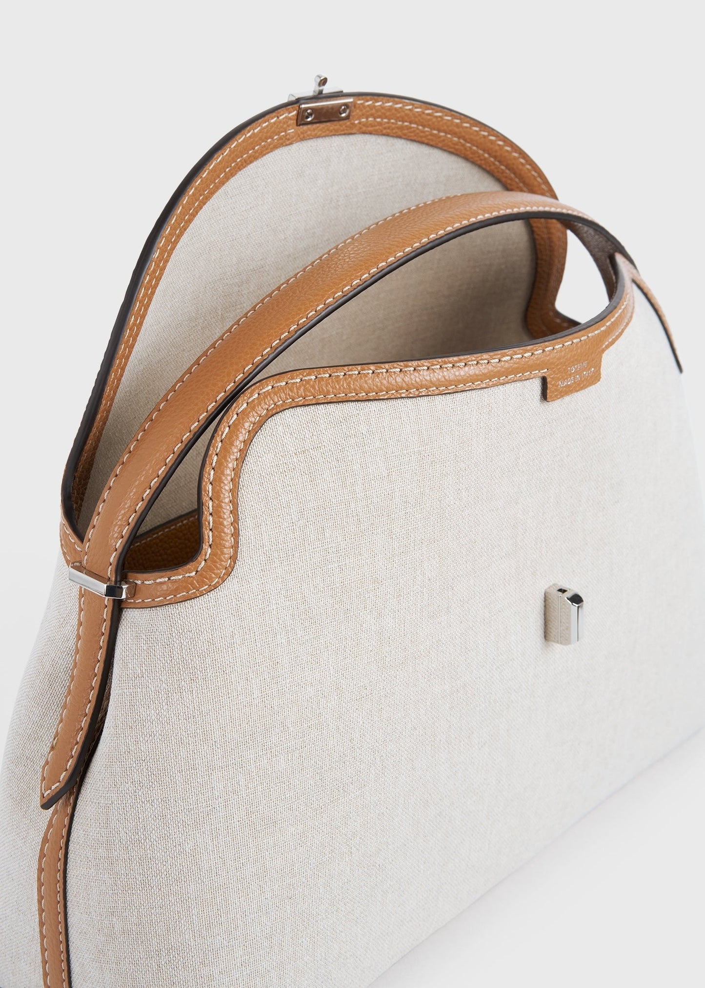 Totême T-Lock Canvas Top Handle in ecru/Tan.