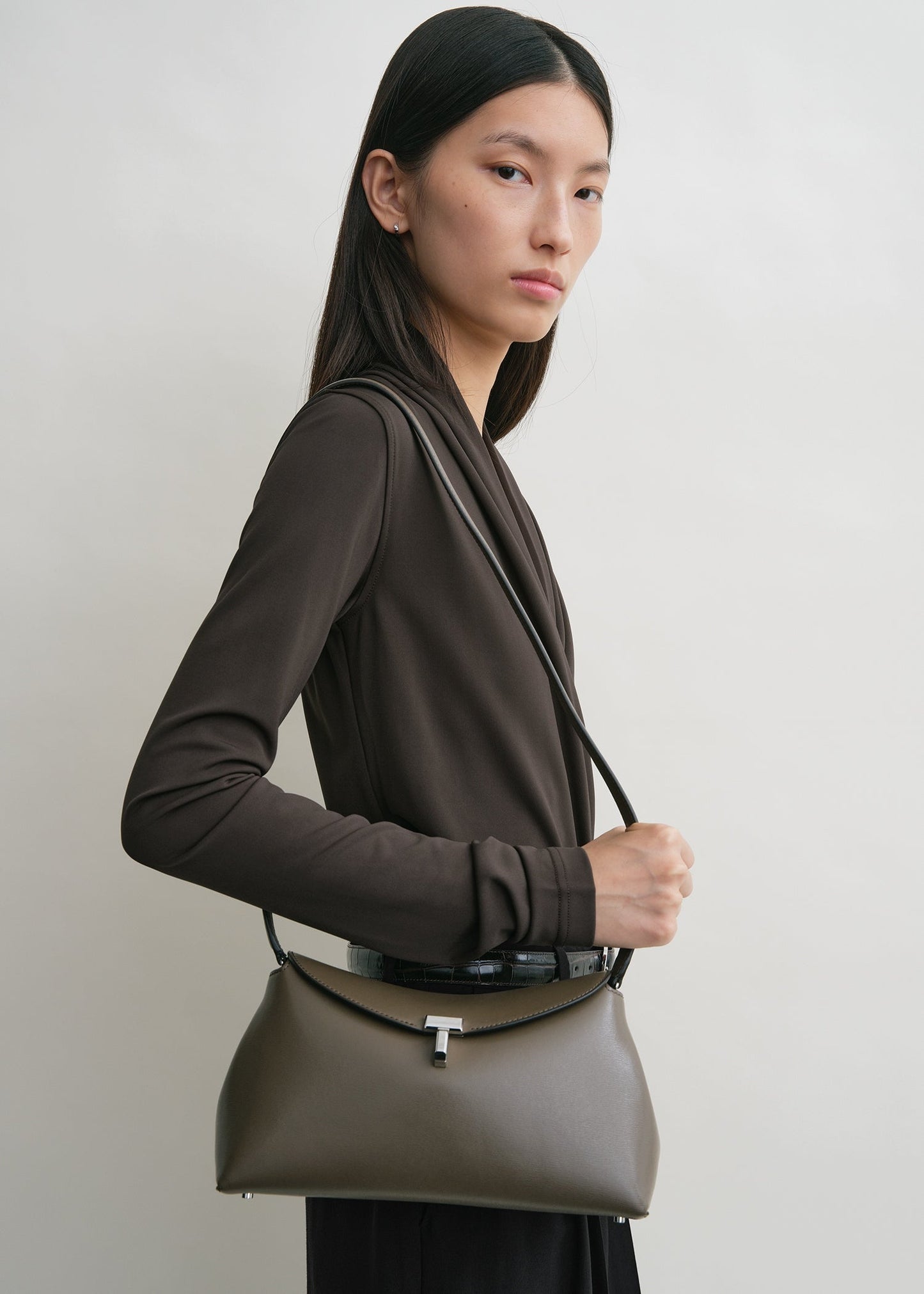 Totême T-Lock Leather Clutch in Taupe