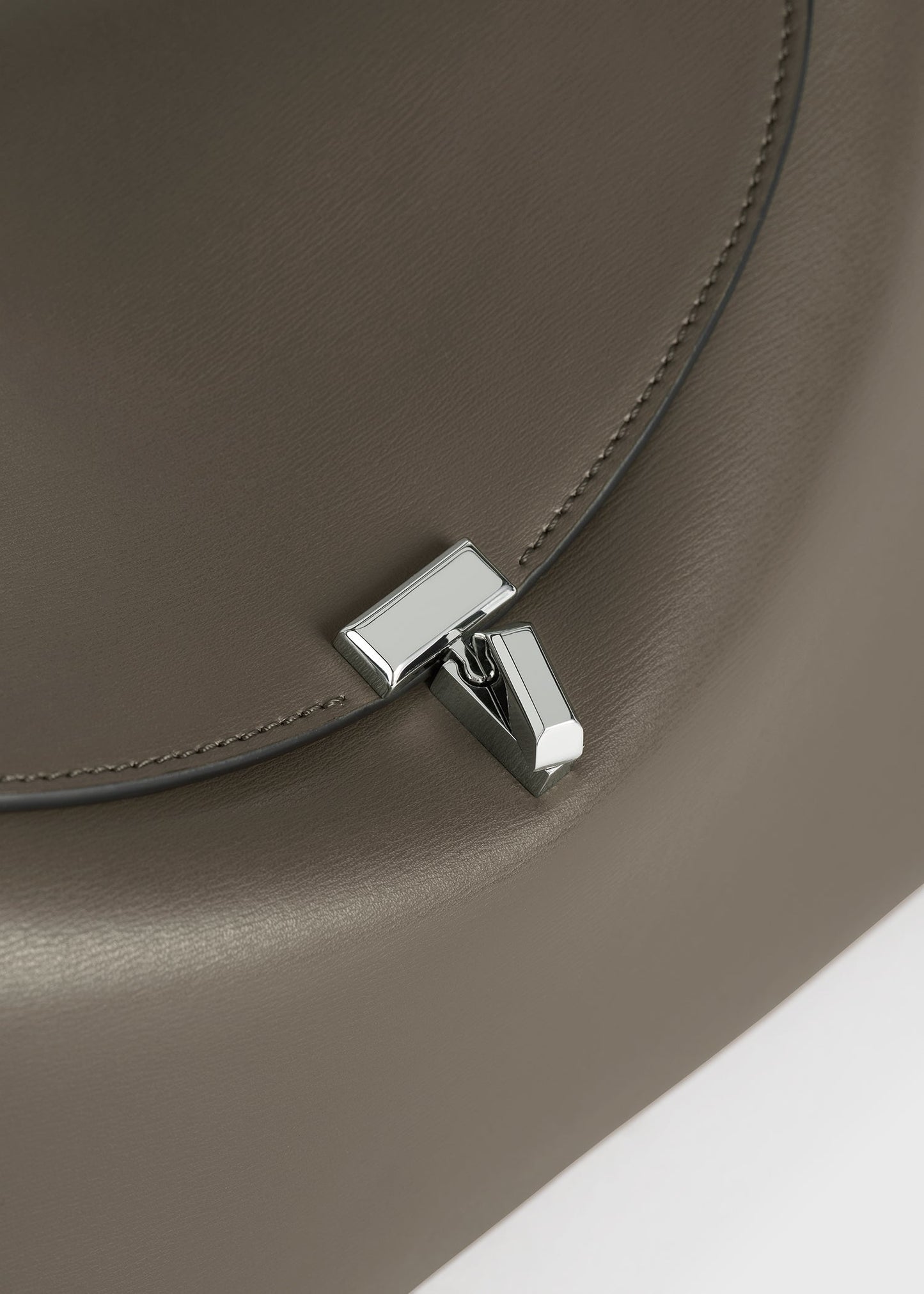 Totême T-Lock Leather Clutch in Taupe