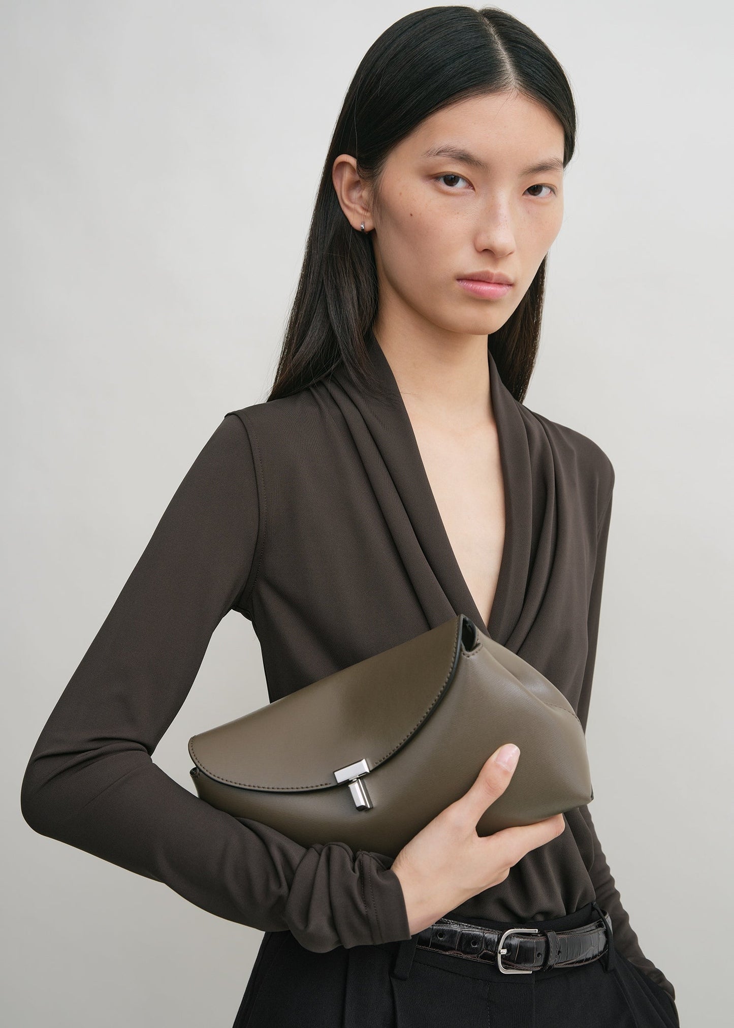 Totême T-Lock Leather Clutch in Taupe